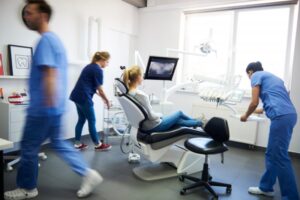 Dentists rushing to help a patient
